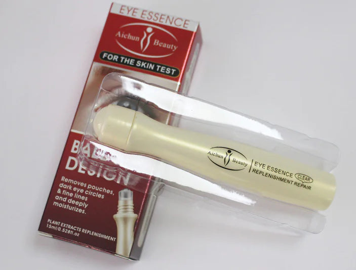 Aichun eye roller with packaging and protective tube displayed on a countertop.