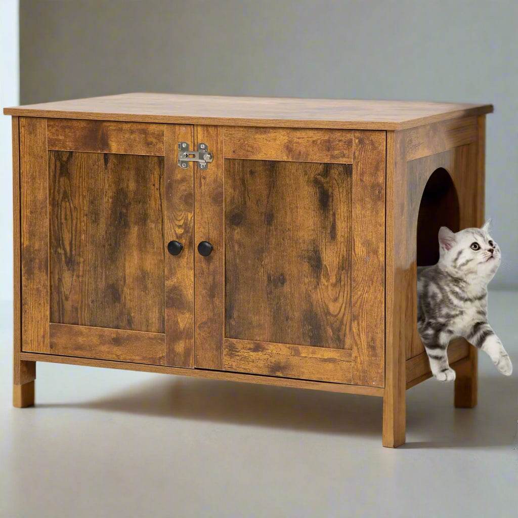 Wooden cat litter box furniture with a gray tabby cat entering side opening