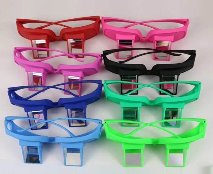 Colorful prism glasses for reading in bed, displayed in red, pink, black, blue, and green.
