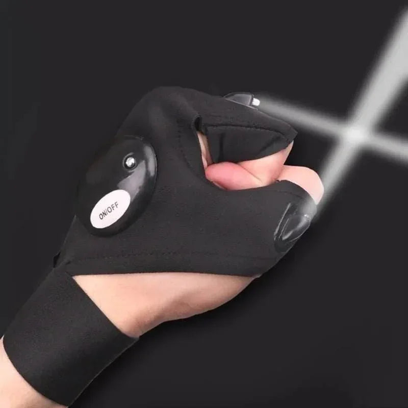 LED flashlight glove worn on hand, black fabric, with on/off button and light beams in dark setting