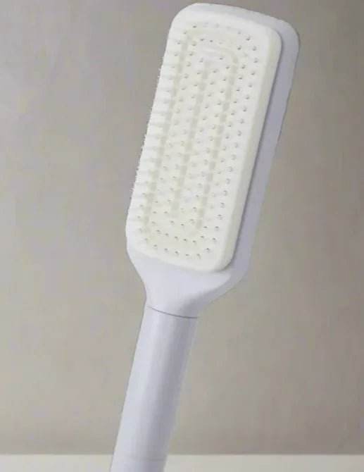 White long-handled cleaning brush with rectangular bristle head against plain background